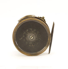 Load image into Gallery viewer, A 1906 rate 4 inch antique brass framed hardy perfect fishing reel  with an ivorine handle shown on a white background With a brass foot.