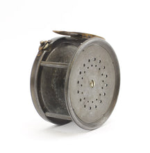 Load image into Gallery viewer, Antique brass faced fishing reel with a center decorative disc and a yellow handle, showing signs of aging and use. 1906 brass faced perfect against a white background